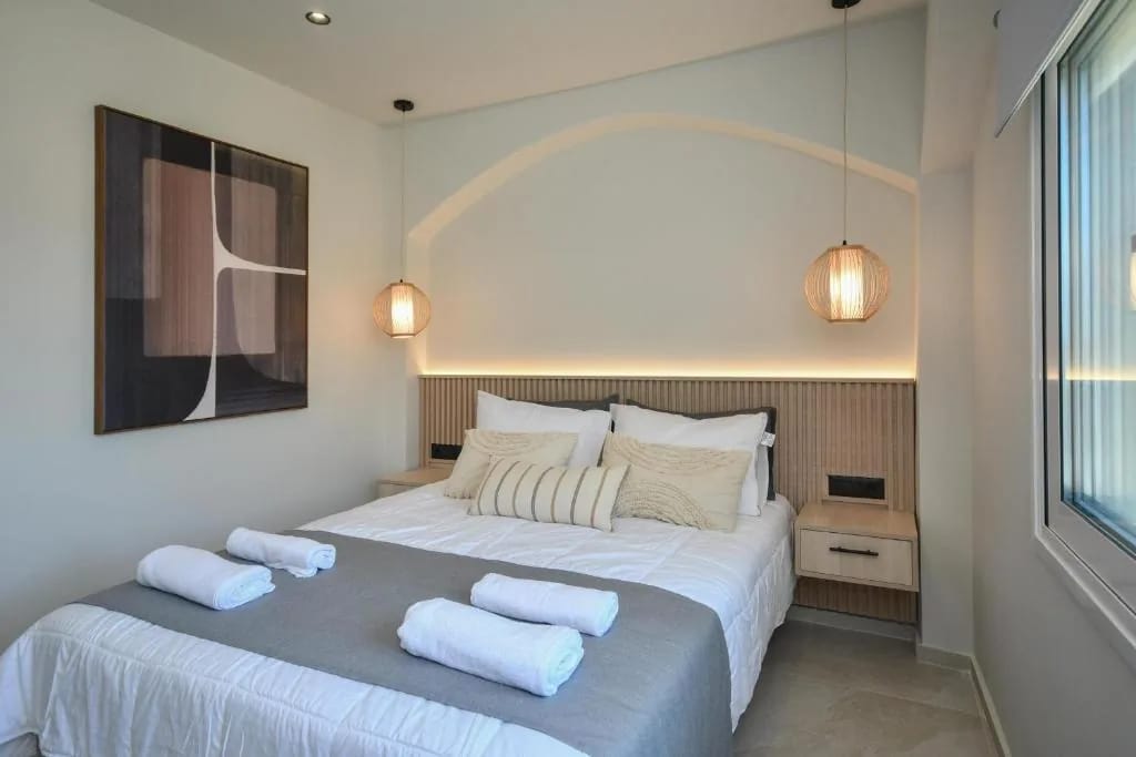 Master bedroom with arched headboard